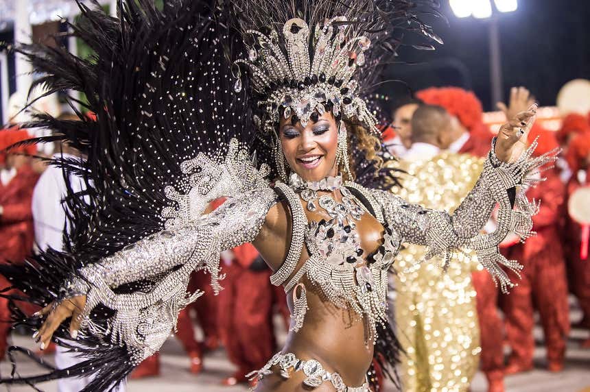 Woman wearing a carnival costume of silver stones dancing in a carnival parade in Rio de Janeiro