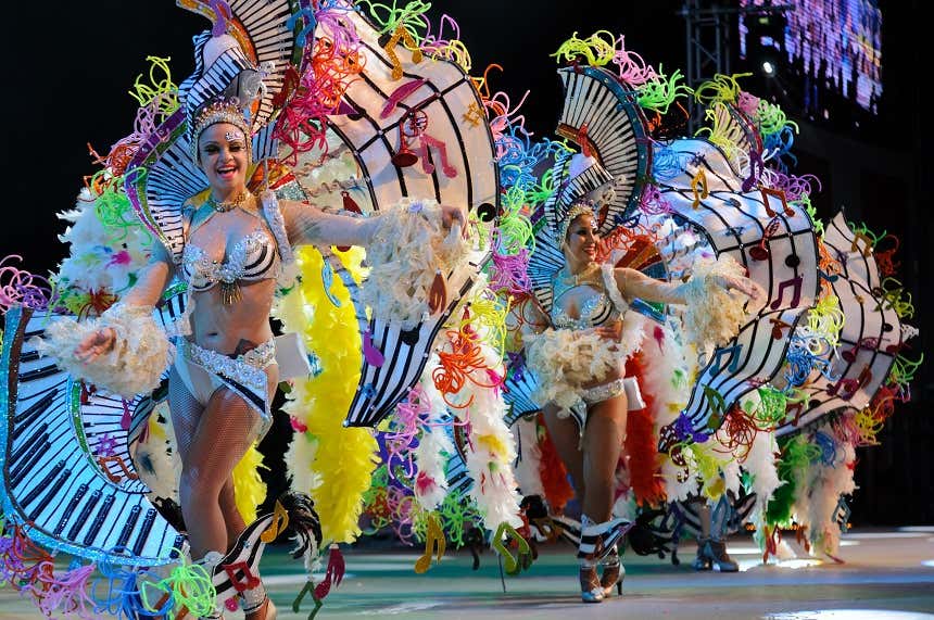 Women in costumes dancing at the Tenerife carnival