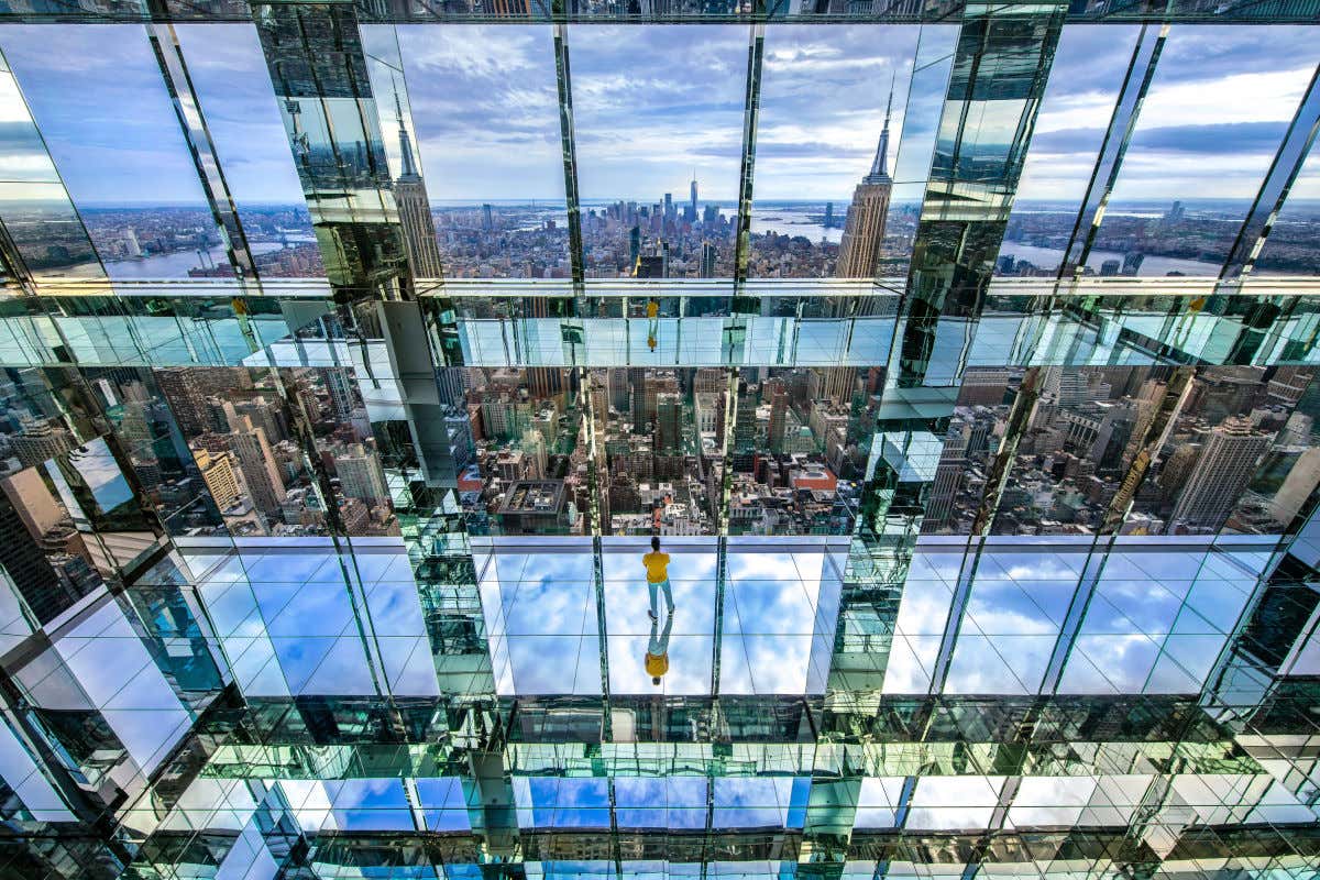 Interior of the mirror-filled Summit One Vanderbilt observation deck overlooking the skyscrapers of downtown New York