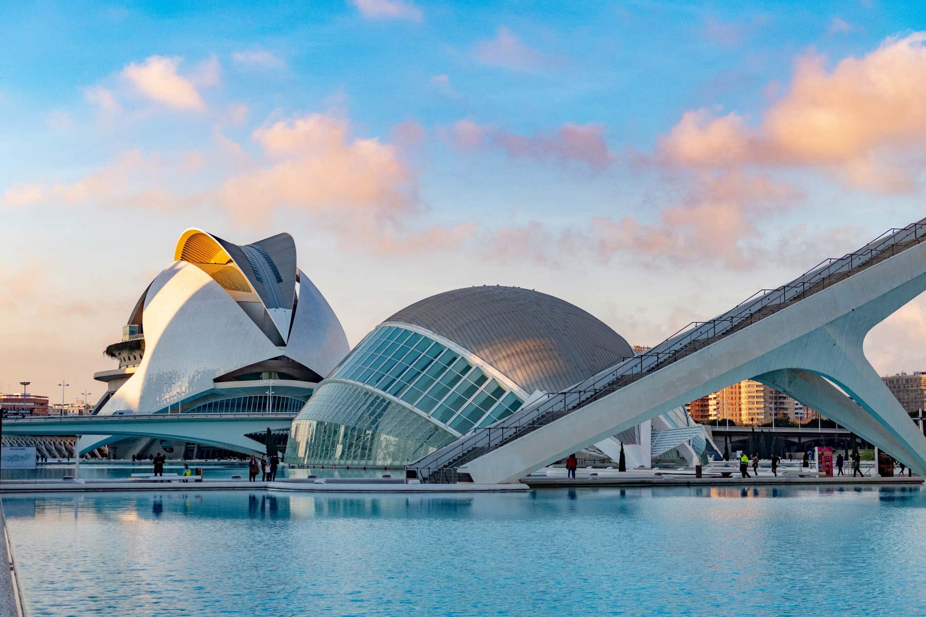 Water outside the modern buildings in the Ciutat de les Arts i Ciències in Valencia at sunset