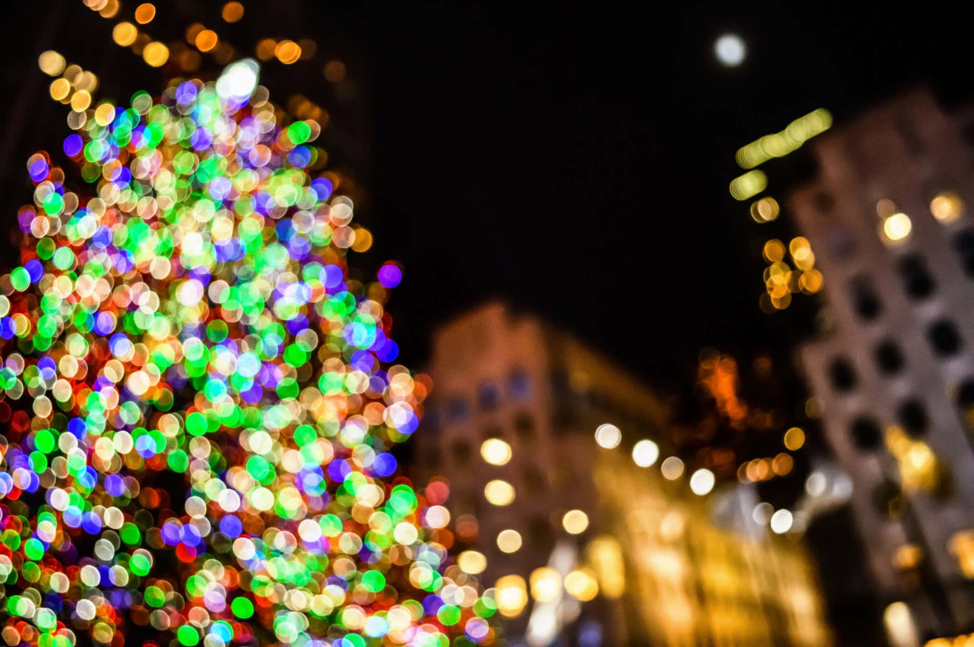 An out of focus picture of the Rockefeller Center Christmas Tree