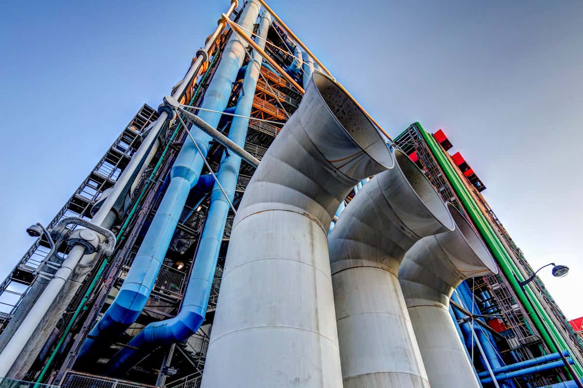 Avant-garde facade of the Georges Pompidou National Center for Art and Culture with different colored pipes and countless steel staircases