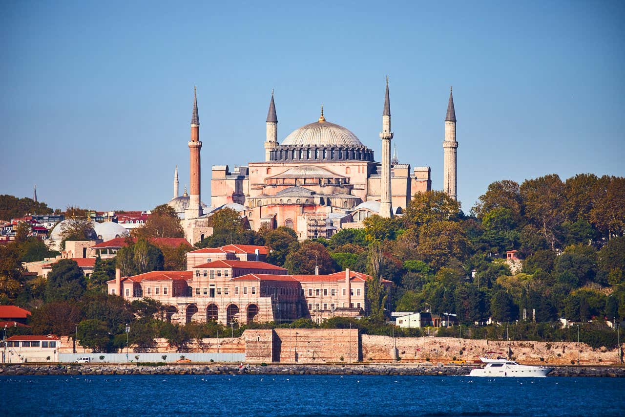 Hagia Sofia in Istanbul as seen from across the water, with a clear sky in the background.