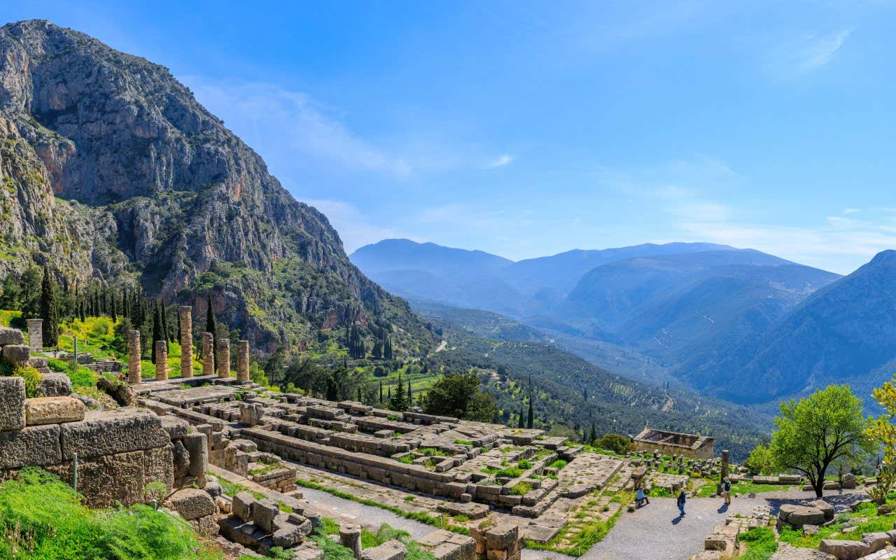 The Temple of Apollo at Delphi, with the mountainous landscape in view in the background.