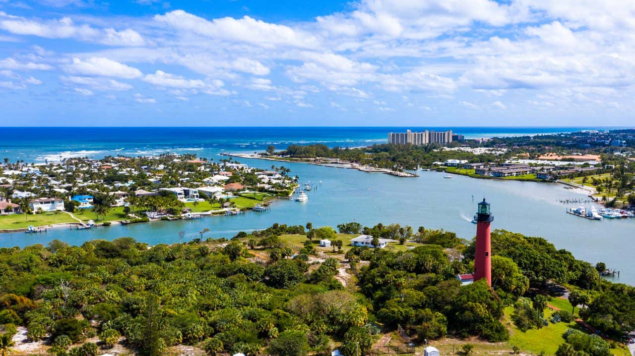 An aerial view of Jupiter Florida with a cloudy blue sky in the background.
