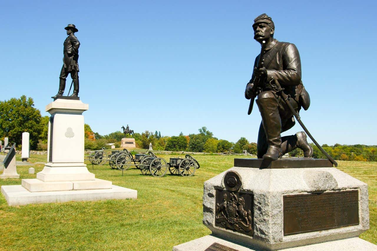 Angled view of several statue monuments at Gettysburg on a sunny day.