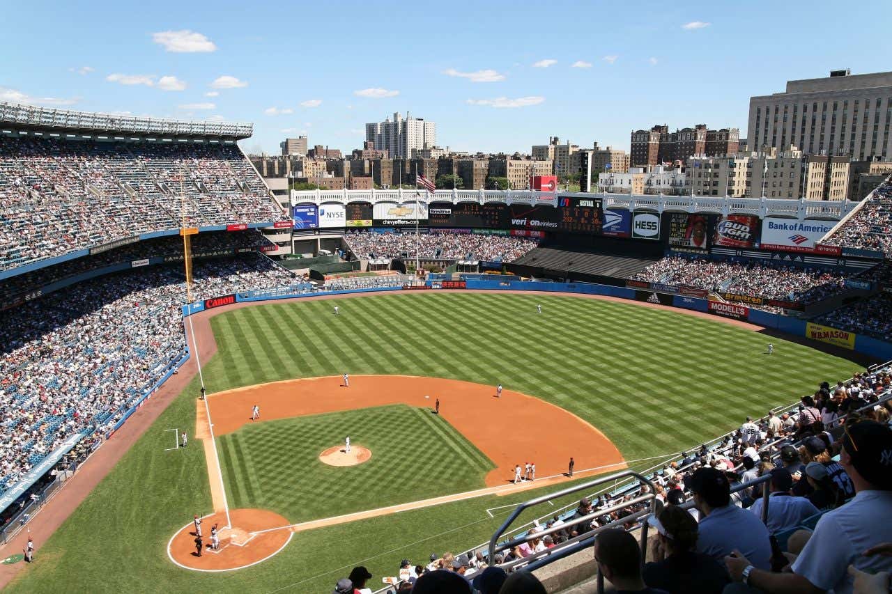 Yankee Stadium as seen from the stands with the skyline in the background.