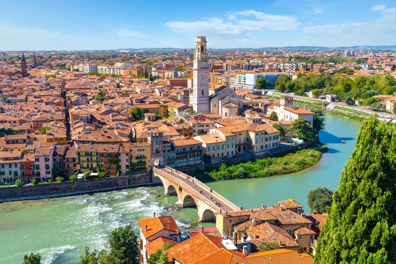 A bridge in Verona seen from above, and the skyline in the background.
