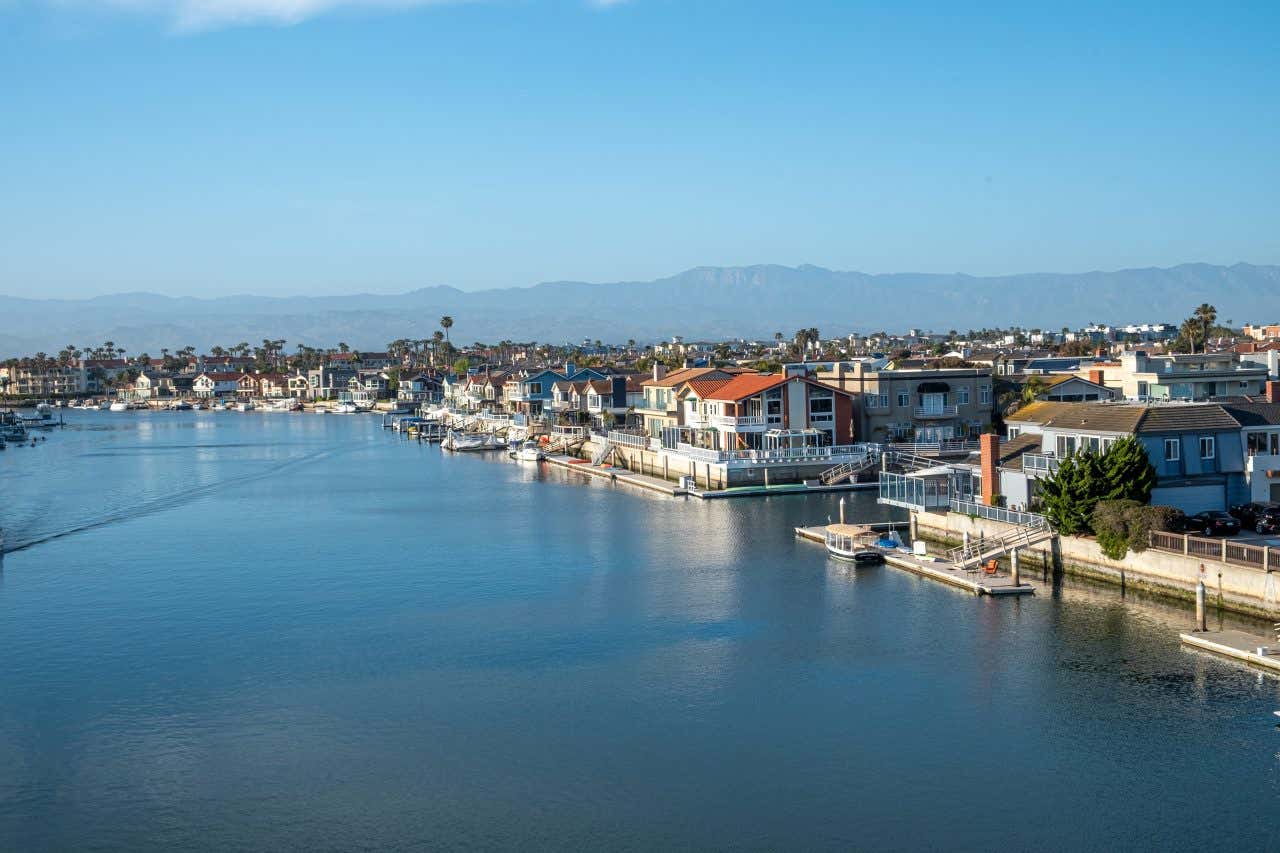 The bay in Ventura, California with a mountain and blue sky in the background.