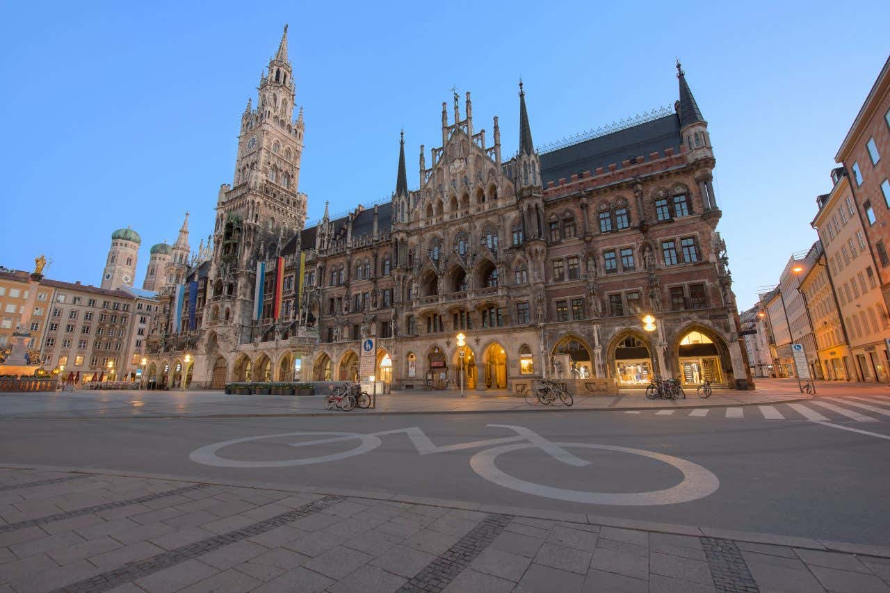 Angled view of Marienplatz in Munich, one of the most bike friendly cities, a bike lane painted on the road in the foreground of the image