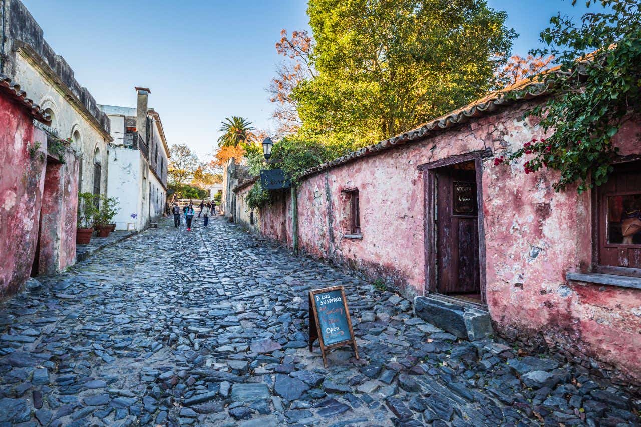 A quiet street in Colonia del Sacramento with a clear blue sky in the background.