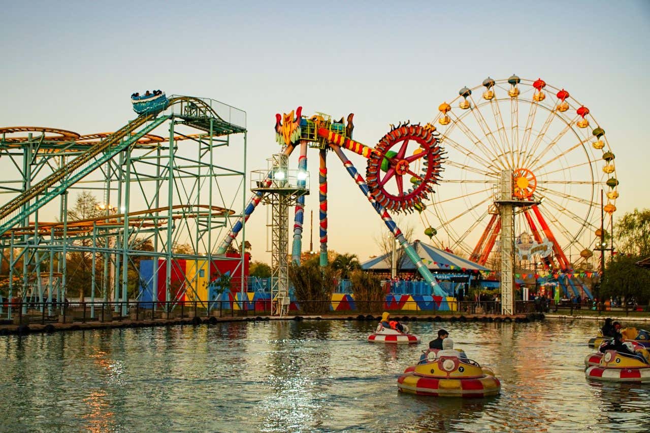 An amusement park, Parque de la Costa with various attractions including rollercoasters visible.