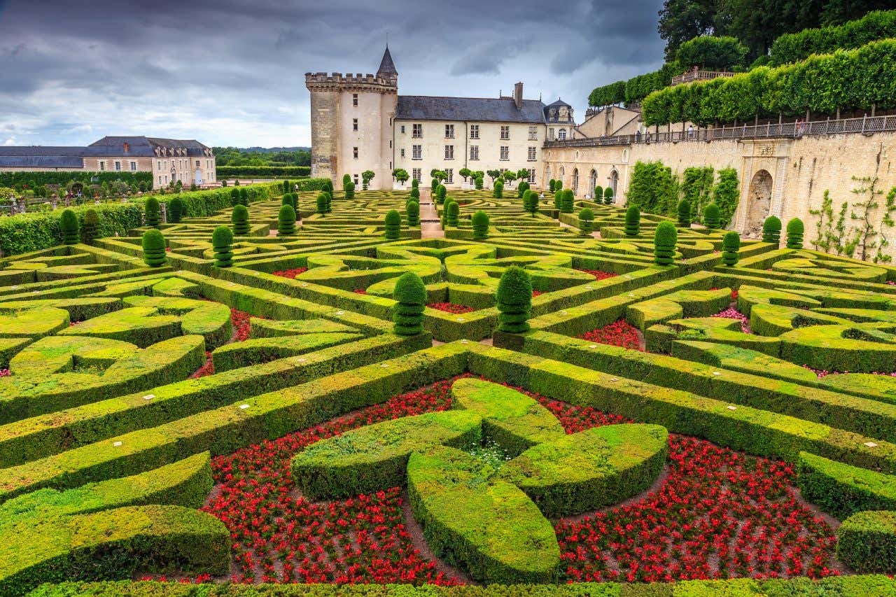 An aerial shot of an intricate geometrically patterned garden in the chateau de Villandry.