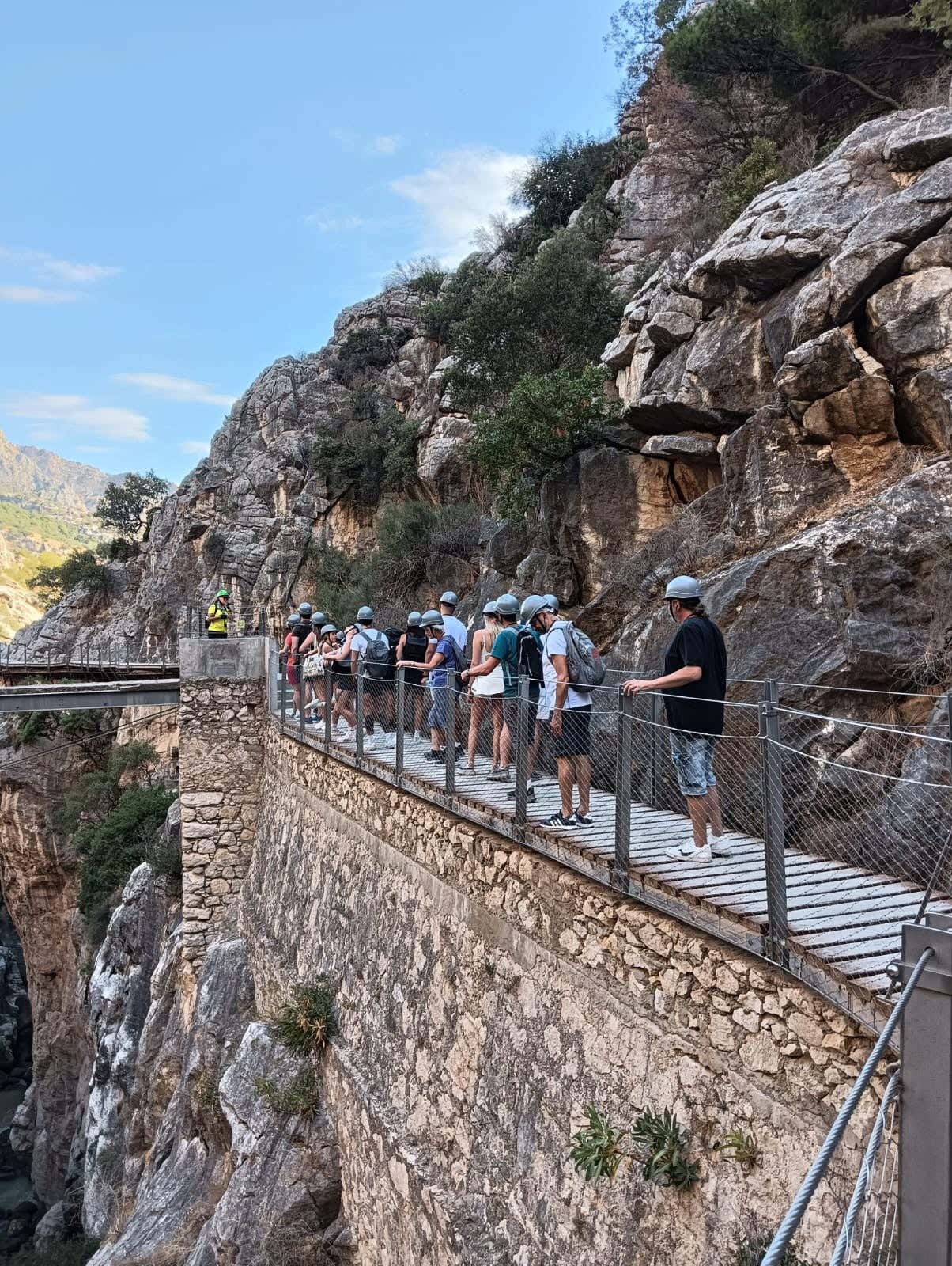 A group of people wearing helmets on the Caminito del Rey hike