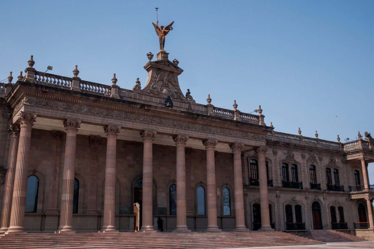 The Palacio Municipal in Monterrey with a clear sky in the background.