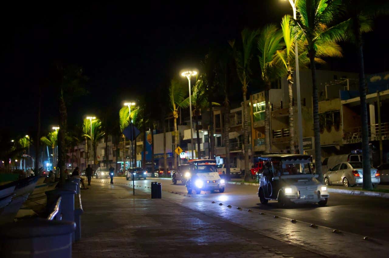 Pulmonías driving along the coastline of Mazatlán at night.