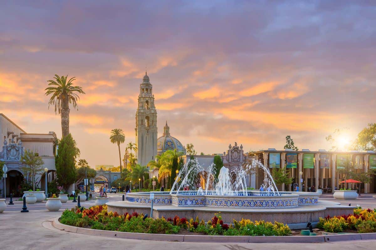 Views of Balboa Park with a fountain at sunset.