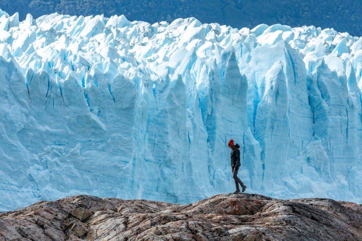 A woman walking on the Perito Moreno Glacier, in El Calafate, Argentina.