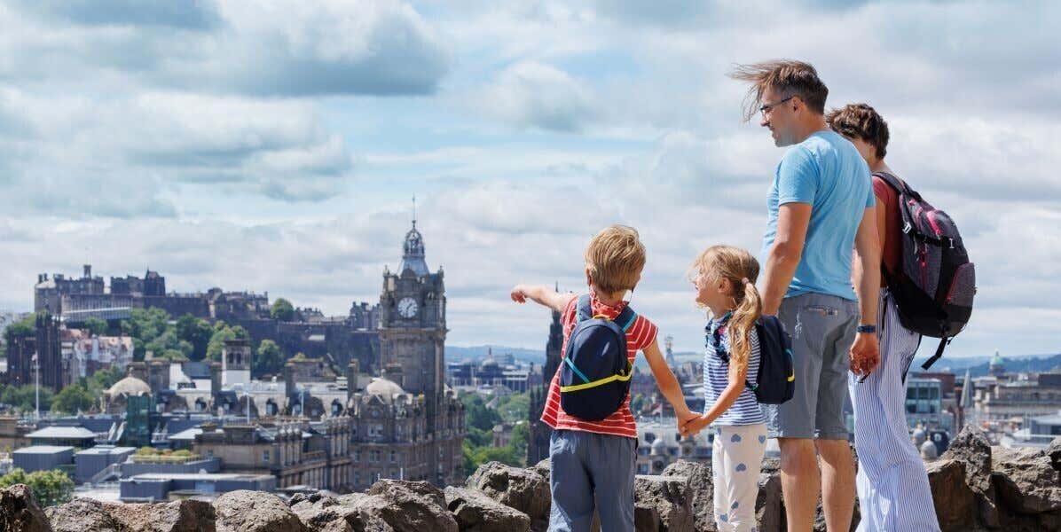 A family of four admiring the views of Edinburgh.