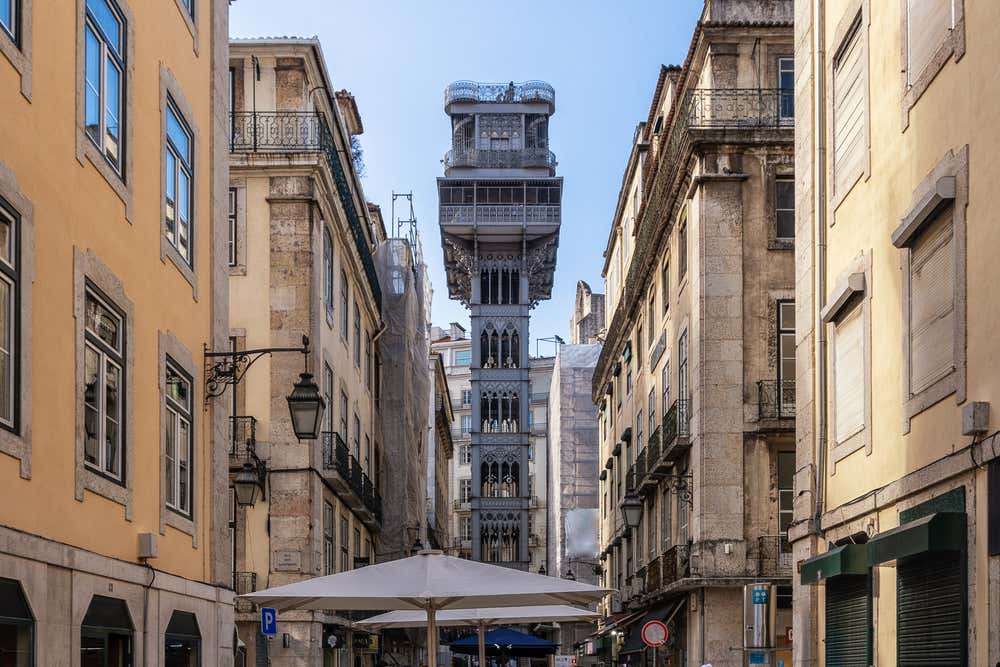 Full view of the Santa Justa Lift in Lisbon seen from the end of the street