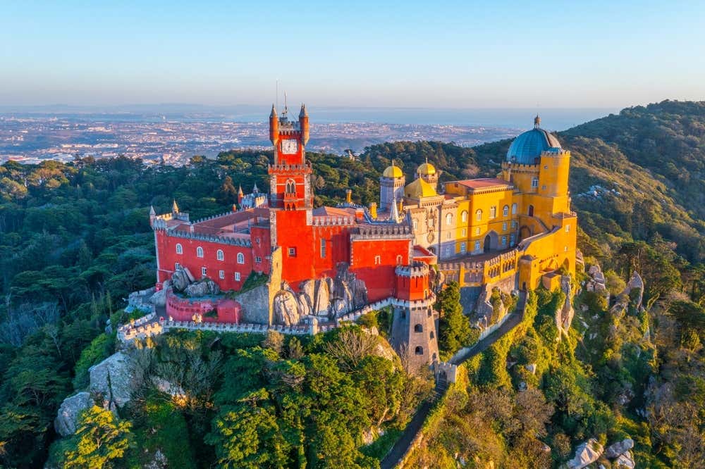 View from above of the Pena Palace in Sintra, Portugal, surrounded by forest