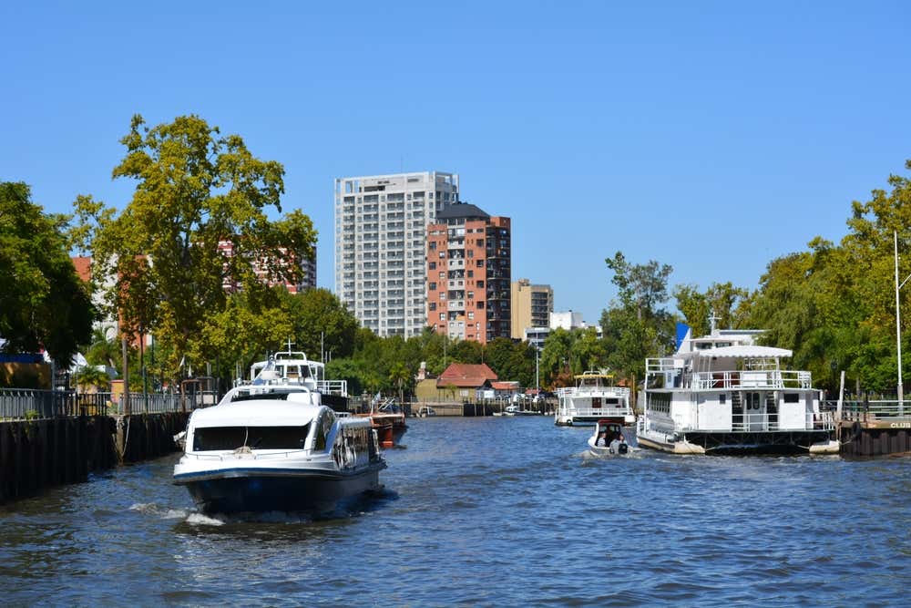 A catamaran sailing along the Tigre river in the Paraná Delta