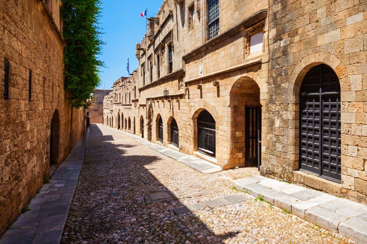The cobblestone Street of the Knights in Rhodes, Greece on a sunny day.