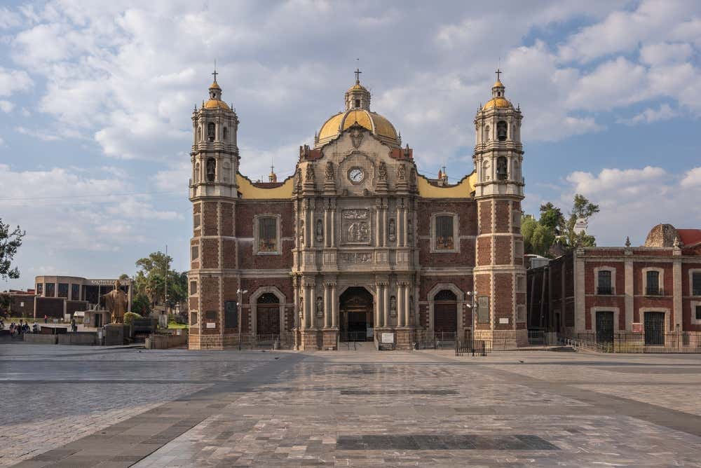 Basílica de Guadalupe, Mexico City with a cloudy sky in the background.