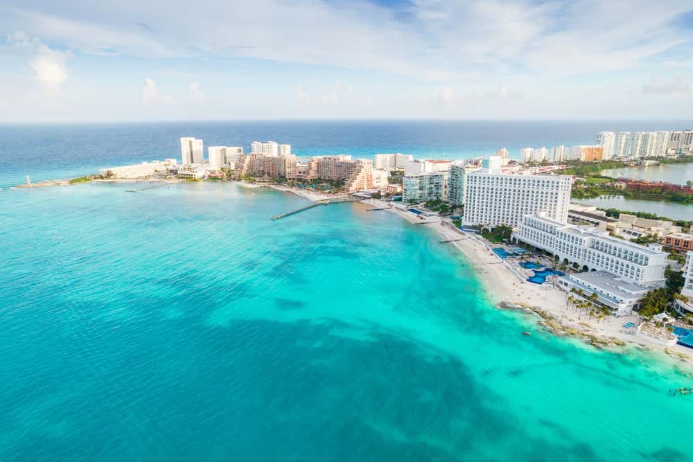 An aerial shot of Playa Caracol with part of the Zona Hotlera of Cancún on the right.