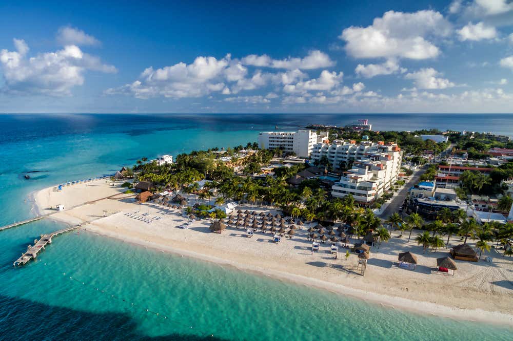 Isla Mujeres aerial view with clouds in the background.