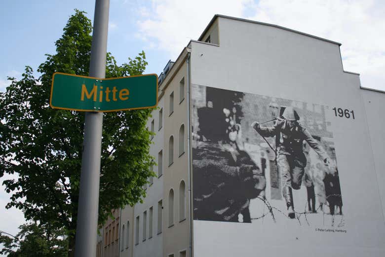 We'll see the mural by Conrad Schumann