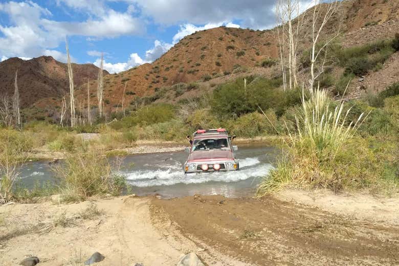 Wading in the jeep through the Castano river