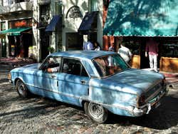 An old car driving around San Telmo