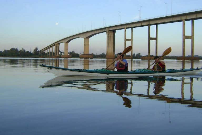 Kayaking under one of the Uruguay River's bridges
