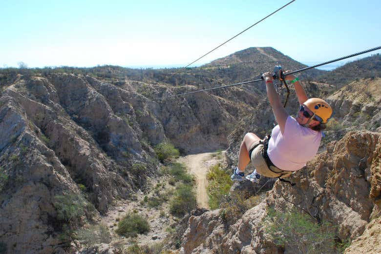 Having fun on the zipline over the Potrerillos Reservoir