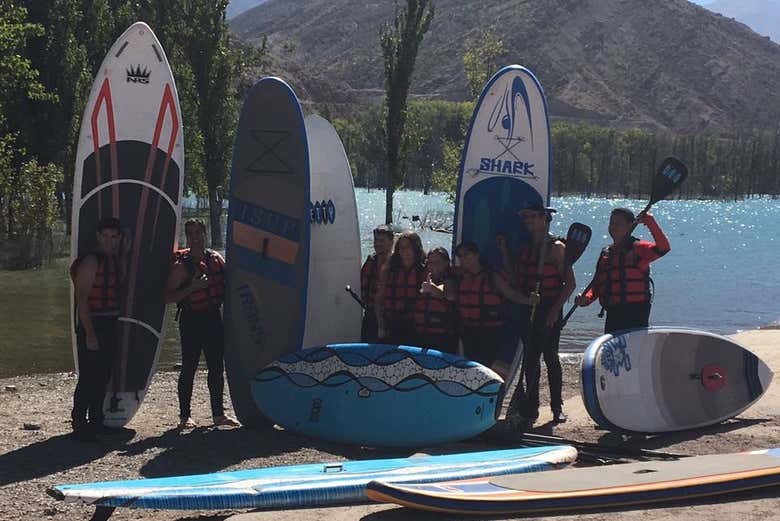 Having fun with friends while paddle surfing