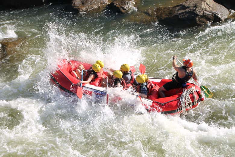 Paddling through the white water of Barron Gorge