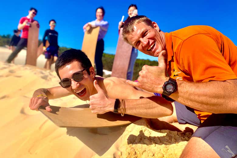 Sandboarding in the dunes of the desert on Moreton Island