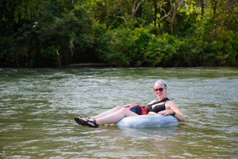 Having fun river tubing in Belize