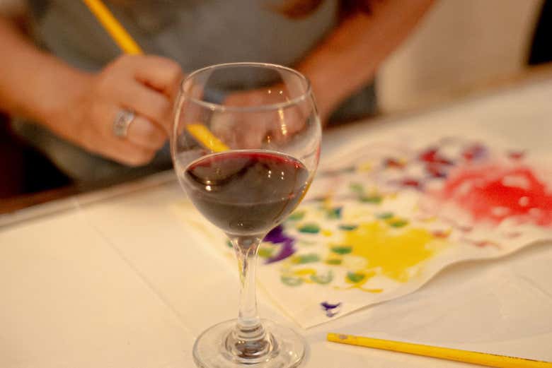 Enjoy a glass of wine during the painting workshop
