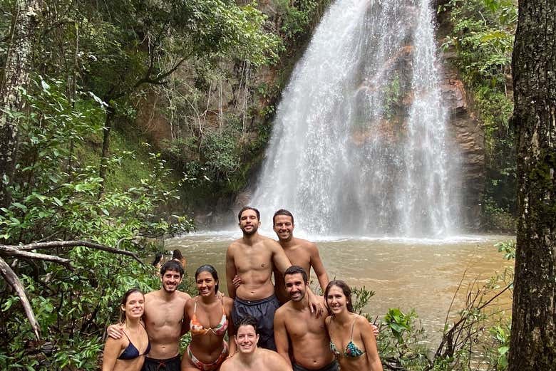 Swim next to a waterfall