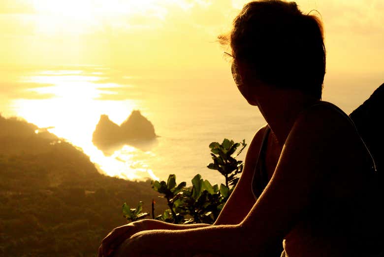 Desfrutando do pôr do sol do morro do Piquinho