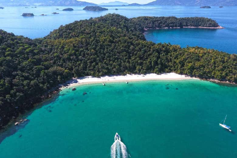 Cruise past the emerald waters of Dentista Beach