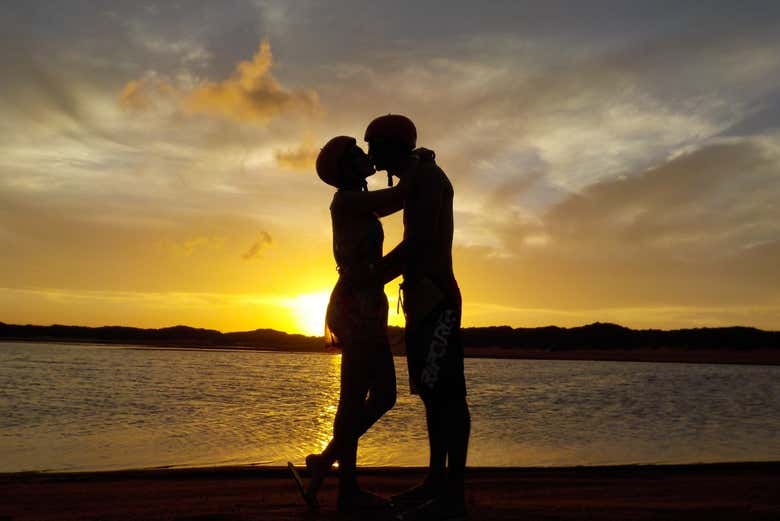 A couple enjoying the sunset in Pirangi do Sul