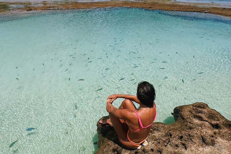 Admire the crystal-clear waters of the beach