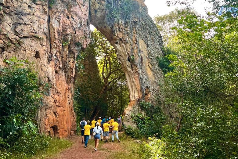 A group passing by rock formations