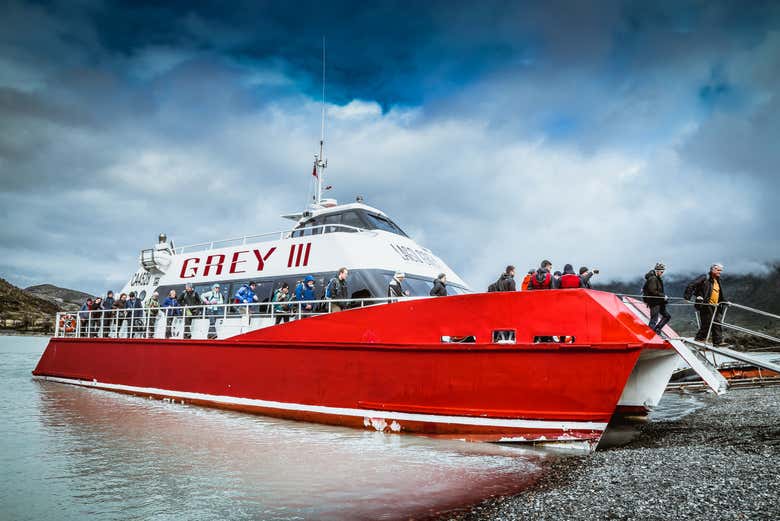 Getting off the boat on the shores of Grey Lake