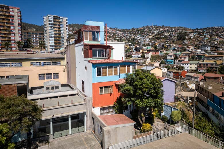 Wander past colorful houses stacked along the hillside