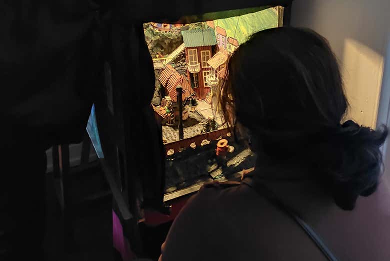 Admiring the charming miniature theatre