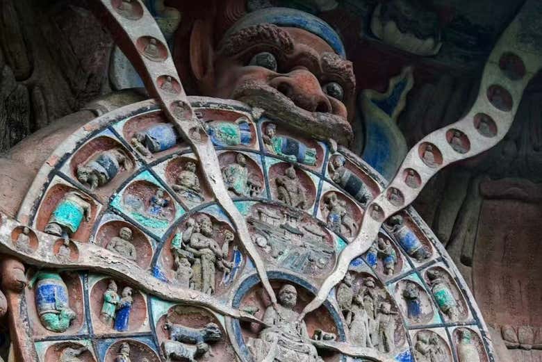 Marvel at the intricate Wheel of Life carving